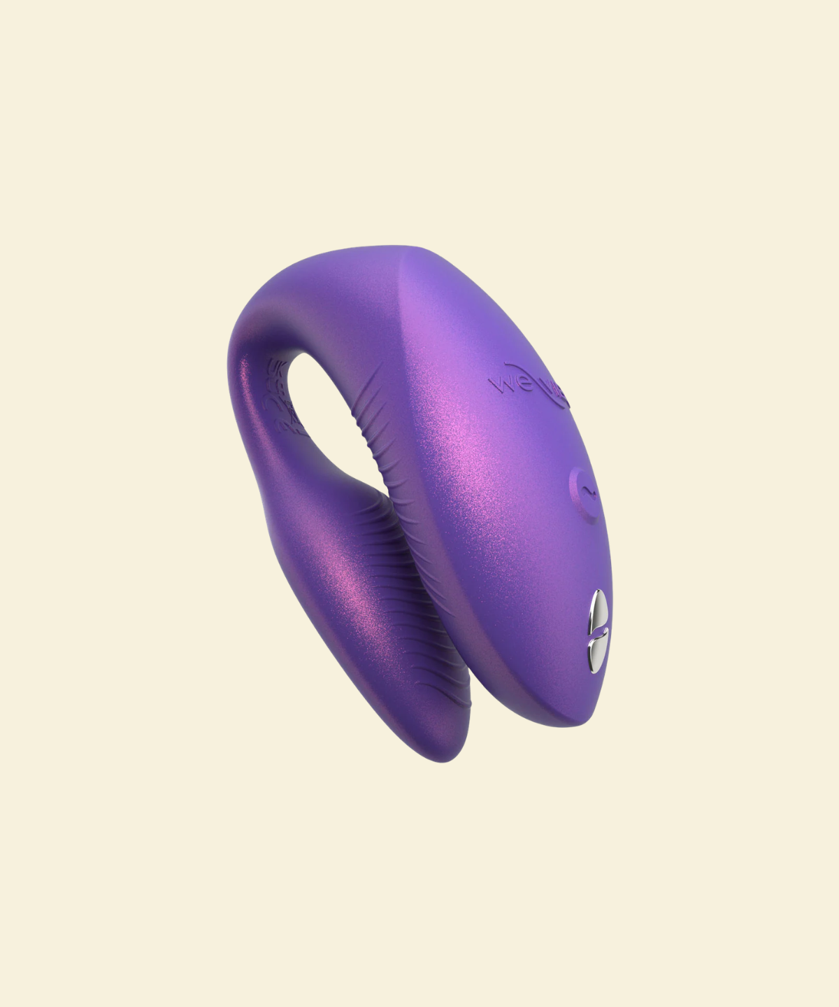 Purple wearable vibrator on beige background