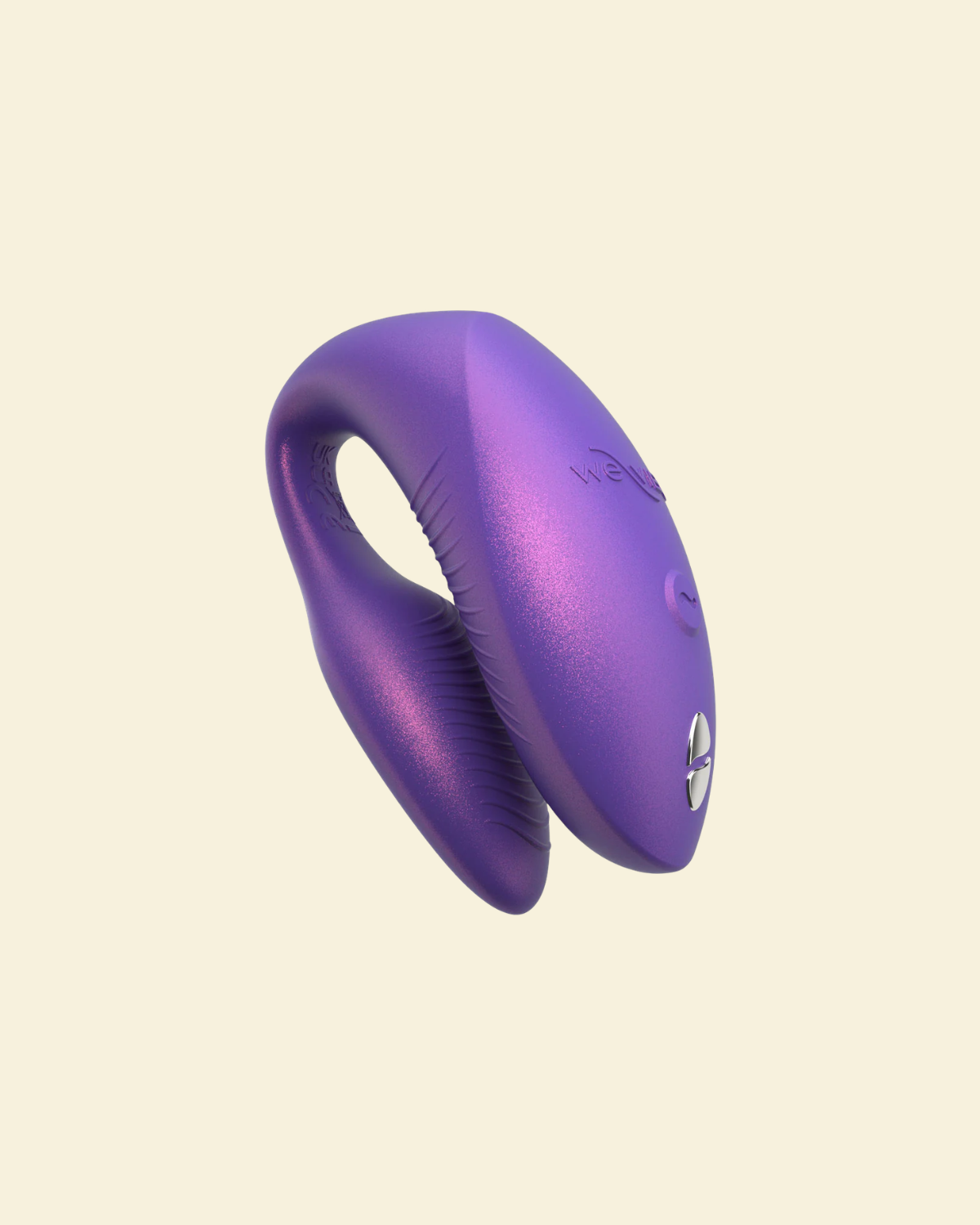 Purple wearable vibrator on beige background