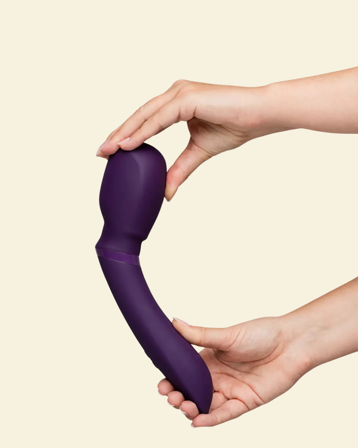 Purple silicone wand vibrator being held by 2 hands 