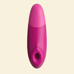 Pink Womanizer Enhance on a beige background - High Tide