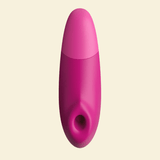Pink Womanizer Enhance on a beige background - High Tide