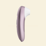 Womanizer Pro on beige background