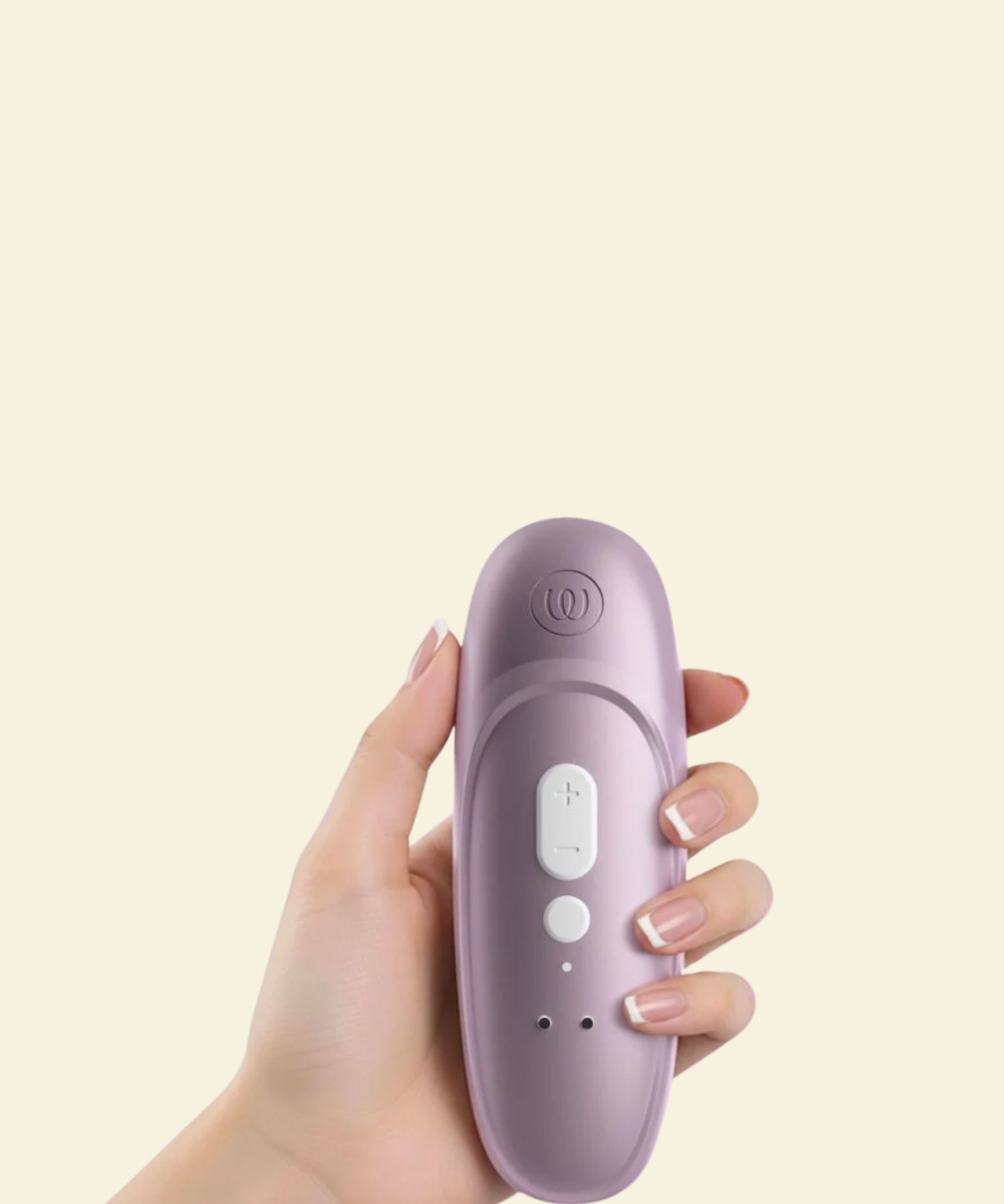 Hand holding the Womanizer Pro showcasing the back and controls
