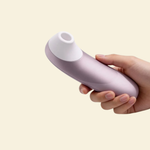 hand holding and showcasing the front of the Womanizer Pro
