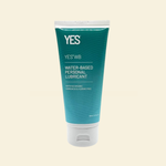 Tube of YES water-based personal lubricant on a beige background
