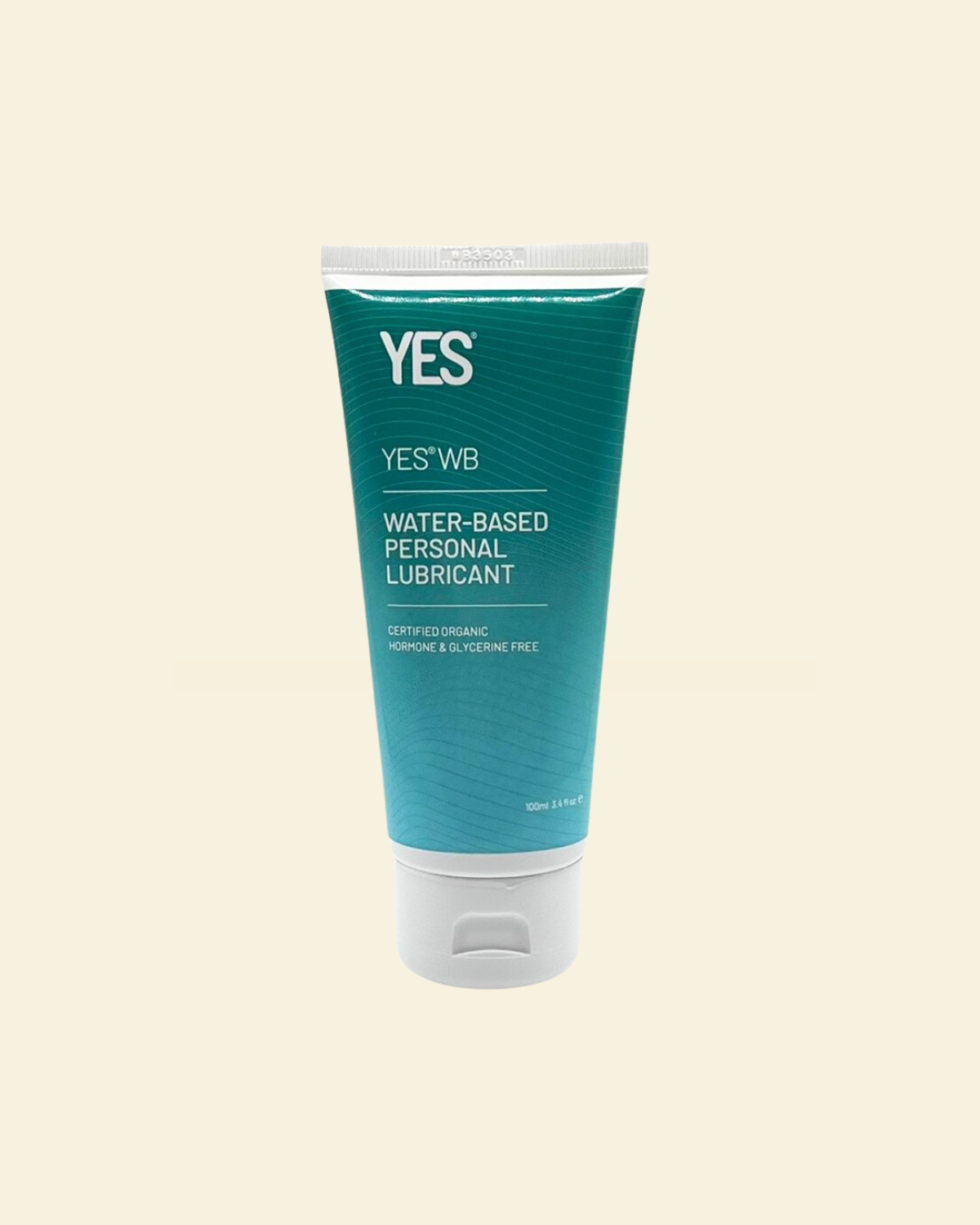 Tube of YES water-based personal lubricant on a beige background